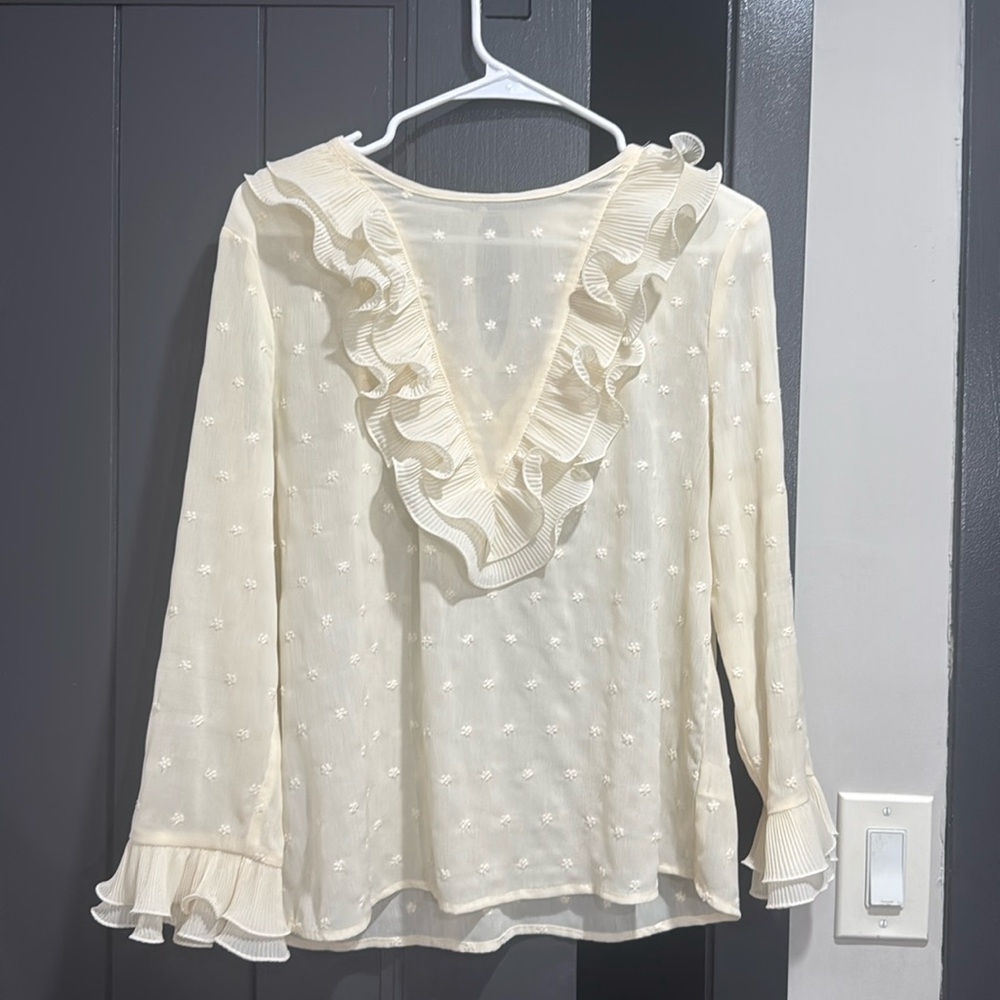 JOA Los Angeles cream ruffle blouse.